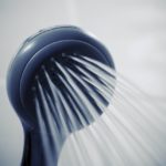 A shower head streaming water