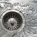 Water swirling down a drain